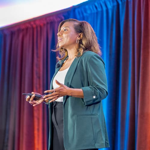 Dominique McSwain speaking on stage